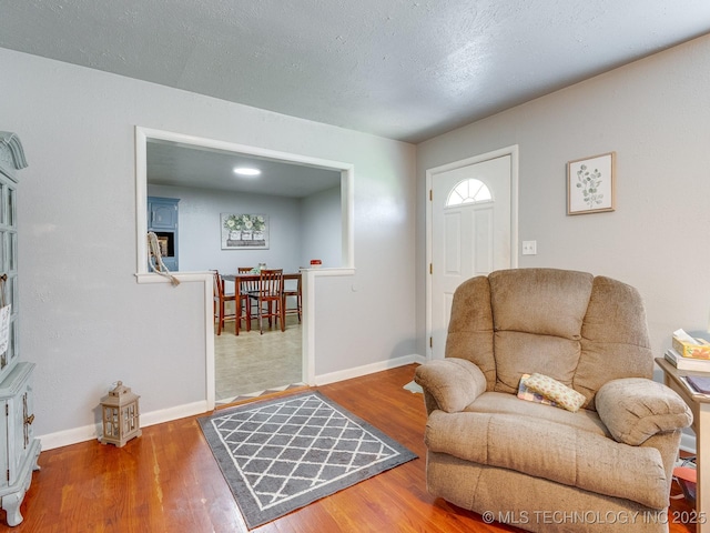 825 W 22nd St, Ada, OK 74820 - entrance foyer with wood finished floors and baseboards