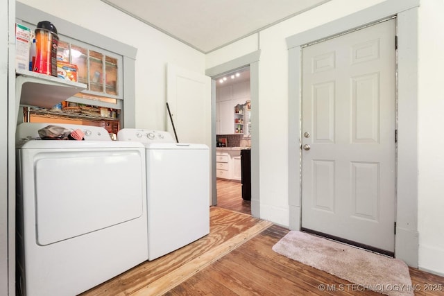 441059 E 155th Rd, Bluejacket, OK 74333 - laundry room with washer and dryer and wood finished floors