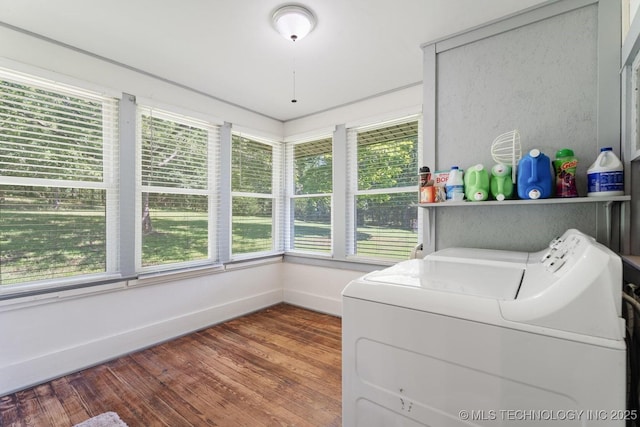 441059 E 155th Rd, Bluejacket, OK 74333 - washroom featuring washing machine and clothes dryer, healthy amount of natural light, and wood finished floors
