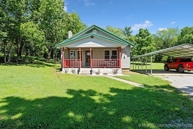441059 E 155th Rd, Bluejacket, OK 74333 - view of front of home with a porch, a detached carport, gravel driveway, a front yard, and a chimney