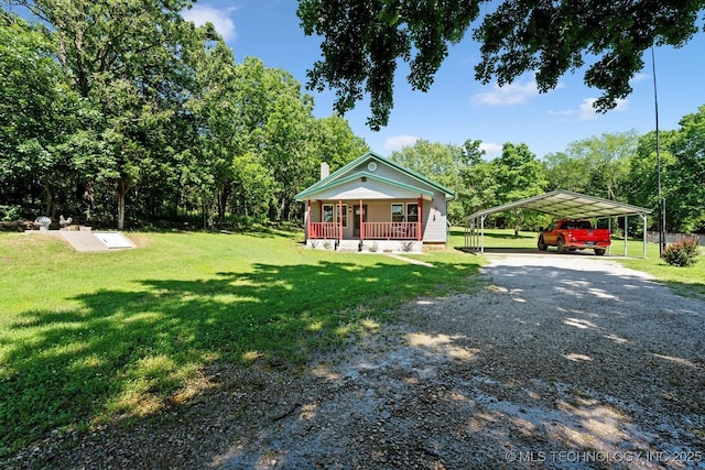 441059 E 155th Rd, Bluejacket, OK 74333 - bungalow-style home with covered porch, gravel driveway, a front yard, and a carport