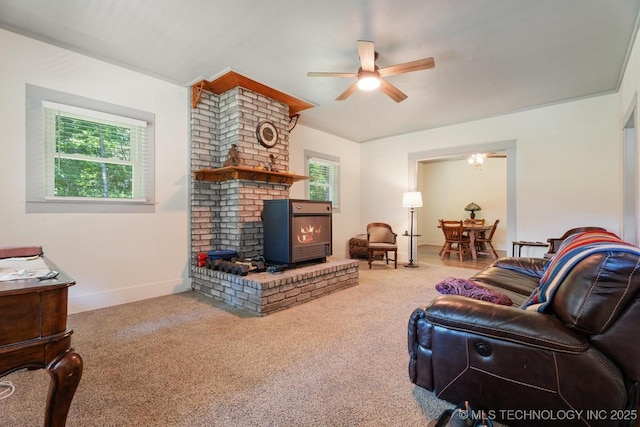 441059 E 155th Rd, Bluejacket, OK 74333 - living area featuring a ceiling fan, carpet, and a wood stove