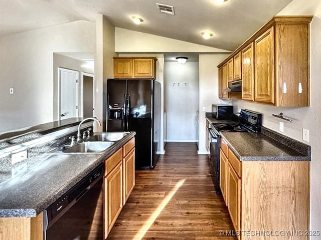 8932 S 258th E Ave, Broken Arrow, OK 74014 - kitchen with black appliances, under cabinet range hood, dark wood finished floors, lofted ceiling, and dark countertops