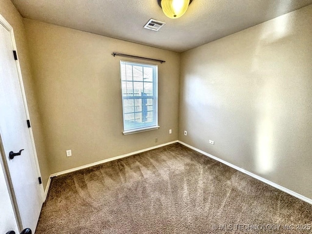 8932 S 258th E Ave, Broken Arrow, OK 74014 - empty room with dark carpet and baseboards