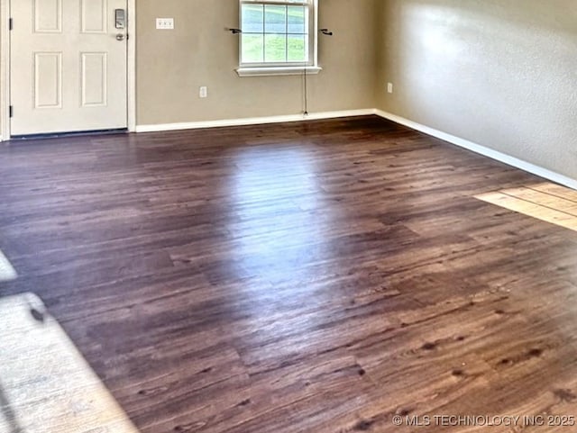 8932 S 258th E Ave, Broken Arrow, OK 74014 - unfurnished room with baseboards and dark wood-style flooring