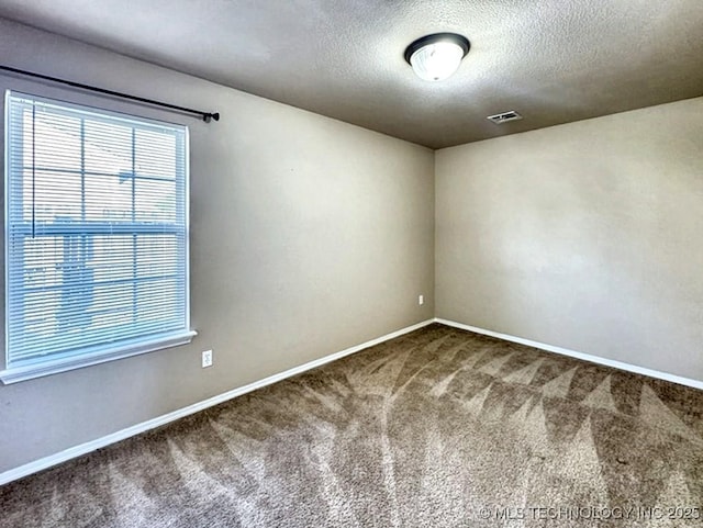 8932 S 258th E Ave, Broken Arrow, OK 74014 - carpeted spare room featuring baseboards and a textured ceiling