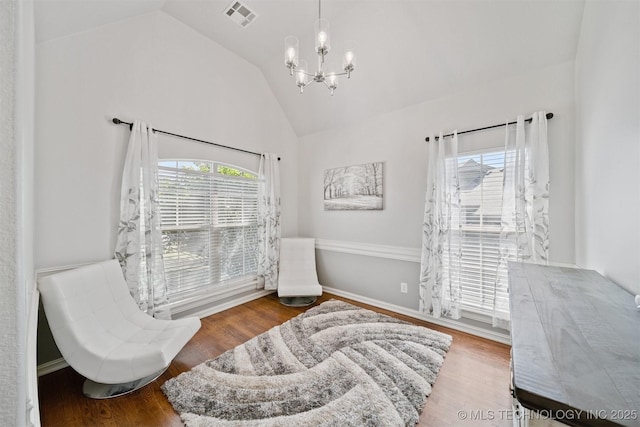 16410 E 49th St, Tulsa, OK 74134 - living area with a chandelier, high vaulted ceiling, and wood finished floors
