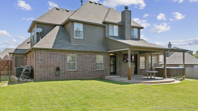 16410 E 49th St, Tulsa, OK 74134 - back of property with a patio, a fenced backyard, a chimney, brick siding, and a shingled roof