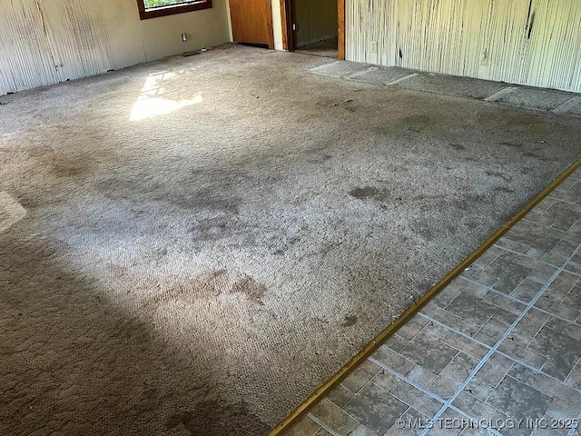 208 Crabapple, Eucha, OK 74342 - carpeted empty room with stone finish floors