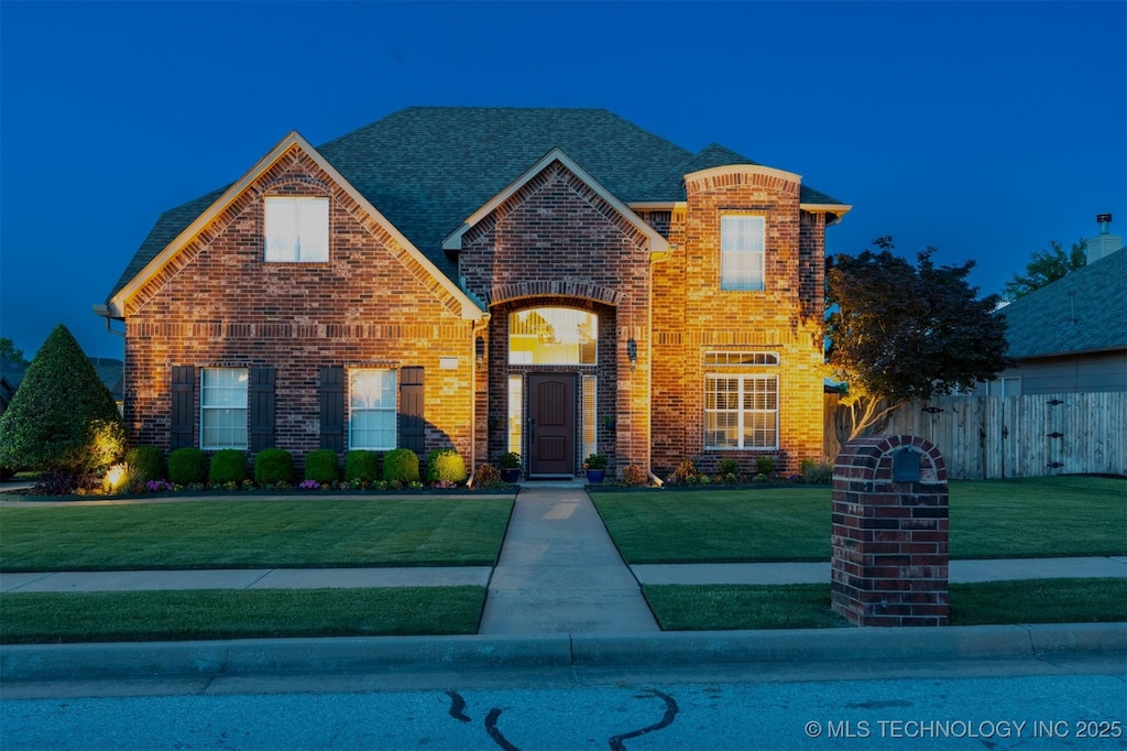 1909 N 8th St, Broken Arrow, OK 74012 - traditional-style house with brick siding and roof with shingles