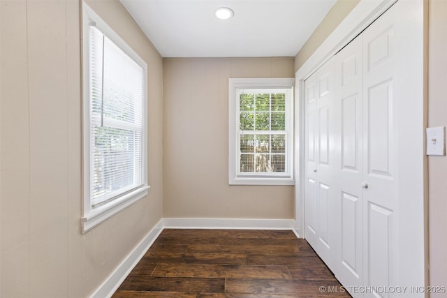 232 E Mohawk Blvd, Tulsa, OK 74106 - unfurnished bedroom with dark wood-style flooring and a closet