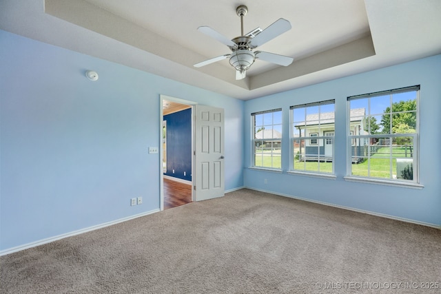 20409 E 49th St S, Broken Arrow, OK 74014 - empty room with a tray ceiling, carpet flooring, ceiling fan, and a smoke detector