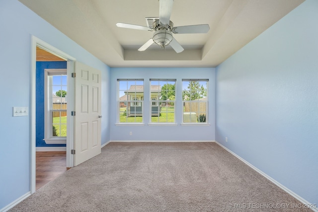 20409 E 49th St S, Broken Arrow, OK 74014 - carpeted spare room with a raised ceiling and ceiling fan