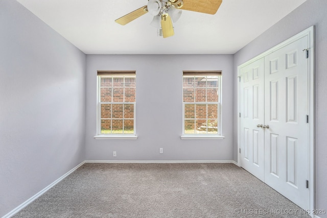 20409 E 49th St S, Broken Arrow, OK 74014 - unfurnished bedroom featuring carpet flooring, a closet, and ceiling fan