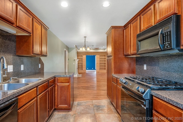 20409 E 49th St S, Broken Arrow, OK 74014 - kitchen with range with gas stovetop, black microwave, dishwasher, brown cabinetry, and recessed lighting