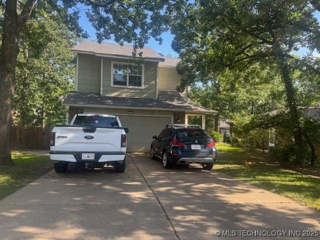 7412 W 38th St, Tulsa, OK 74107 - view of front of home with concrete driveway and a garage