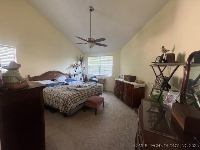 7412 W 38th St, Tulsa, OK 74107 - bedroom with carpet, vaulted ceiling, and ceiling fan