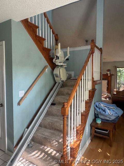 7412 W 38th St, Tulsa, OK 74107 - stairs with wood finished floors and a textured ceiling