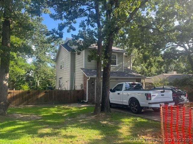 7412 W 38th St, Tulsa, OK 74107 - view of side of home with brick siding and an attached garage