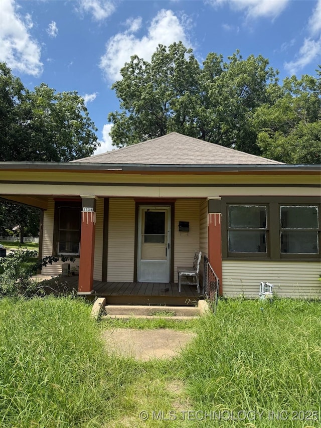 1223 Stanley Ave SW, Ardmore, OK 73401 - bungalow with covered porch and a shingled roof