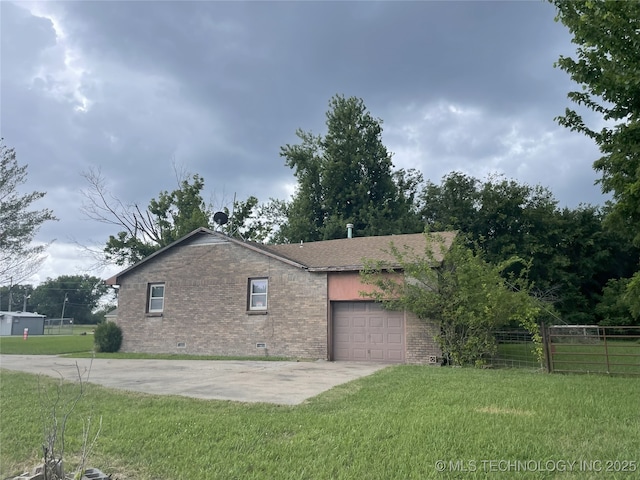 55250 E 297th Rd, Afton, OK 74331 - view of side of home with brick siding, crawl space, an attached garage, and concrete driveway