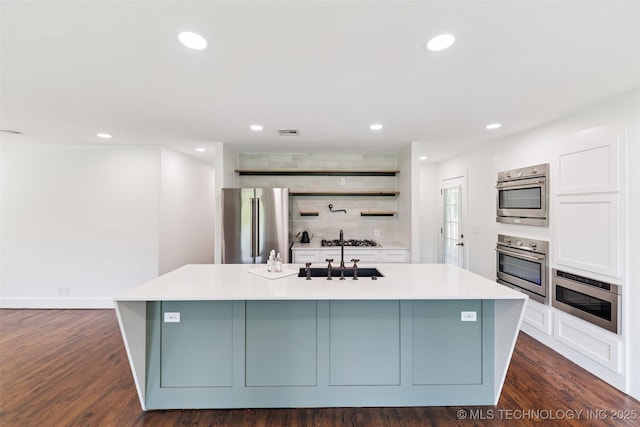 33966 S 4310th Rd, Big Cabin, OK 74332 - kitchen featuring appliances with stainless steel finishes, open shelves, light countertops, a center island with sink, and recessed lighting
