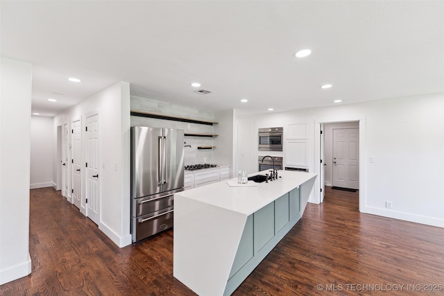 33966 S 4310th Rd, Big Cabin, OK 74332 - kitchen with stainless steel appliances, open shelves, an island with sink, dark wood-type flooring, and recessed lighting