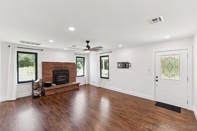 33966 S 4310th Rd, Big Cabin, OK 74332 - unfurnished living room with recessed lighting, dark wood finished floors, a wood stove, and a ceiling fan