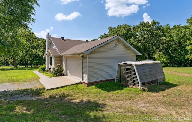 33966 S 4310th Rd, Big Cabin, OK 74332 - view of property exterior with a chimney, a garage, a yard, and roof with shingles