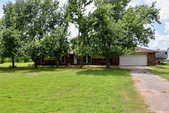 27855 S 170th Rd, Henryetta, OK 74437 - obstructed view of property with asphalt driveway, a garage, a front lawn, and stone siding
