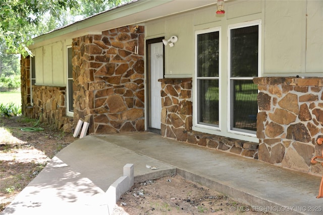 27855 S 170th Rd, Henryetta, OK 74437 - doorway to property featuring stone siding