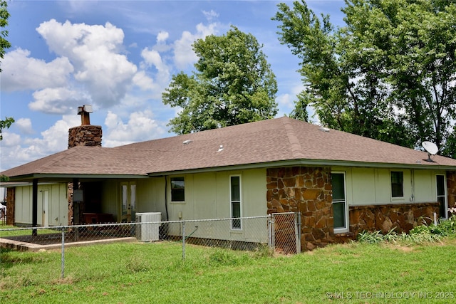 27855 S 170th Rd, Henryetta, OK 74437 - rear view of property featuring stone siding, a chimney, and roof with shingles