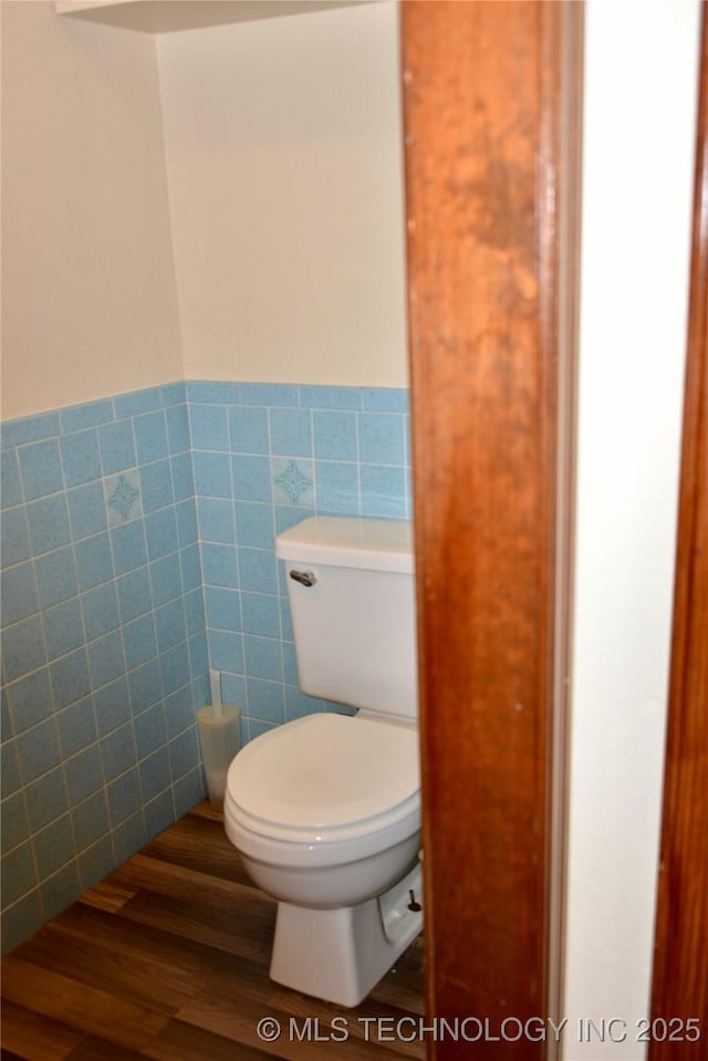 27855 S 170th Rd, Henryetta, OK 74437 - bathroom with tile walls, wood finished floors, and a wainscoted wall