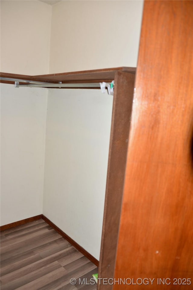 27855 S 170th Rd, Henryetta, OK 74437 - walk in closet featuring wood finished floors