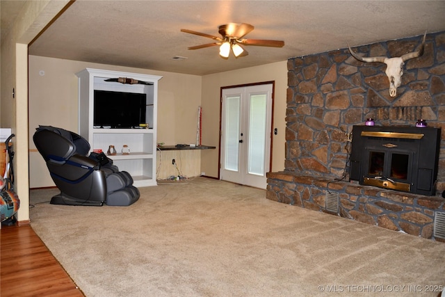 27855 S 170th Rd, Henryetta, OK 74437 - living room with a ceiling fan, a textured ceiling, wood finished floors, and carpet floors