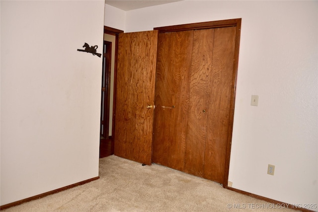 27855 S 170th Rd, Henryetta, OK 74437 - unfurnished bedroom featuring light colored carpet and a closet