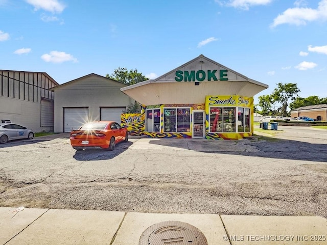 824 S California, Atoka, OK 74525 - view of commercial property with a detached garage