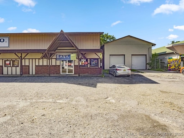 824 S California, Atoka, OK 74525 - view of front of property with a garage