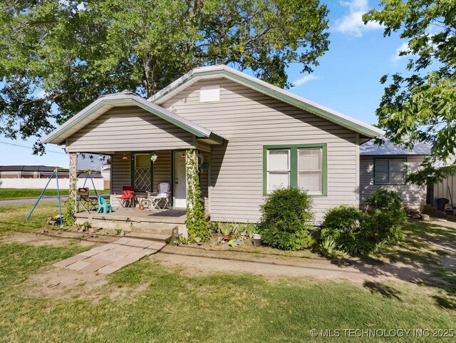 824 S California, Atoka, OK 74525 - bungalow with covered porch and a front lawn