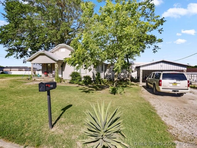 824 S California, Atoka, OK 74525 - view of front of home featuring a front yard and covered porch