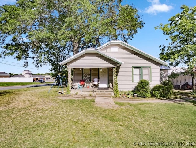824 S California, Atoka, OK 74525 - bungalow-style house featuring covered porch and a front yard