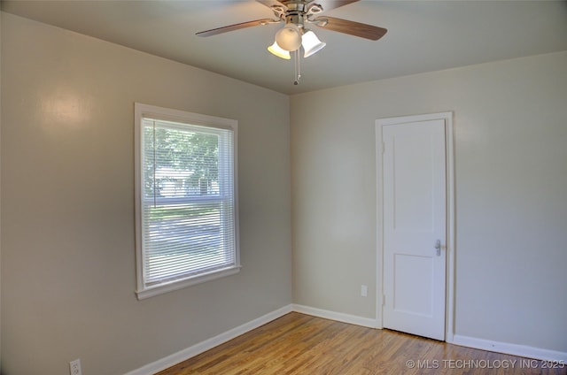 3833 E 22nd St, Tulsa, OK 74114 - empty room with wood finished floors and a ceiling fan