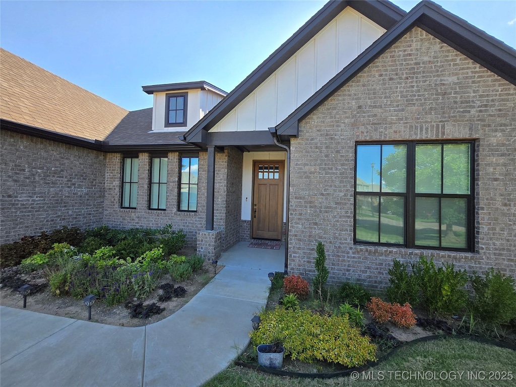 3610 S Fir Ct W, Broken Arrow, OK 74011 - property entrance featuring board and batten siding and brick siding