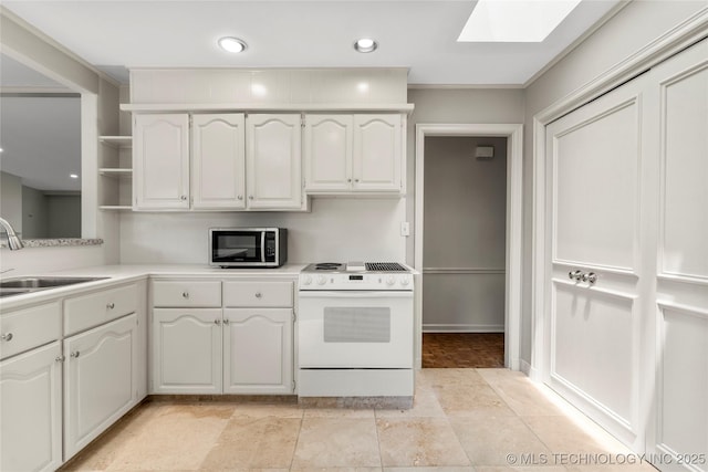 kitchen featuring white electric stove, stainless steel microwave, open shelves, white cabinets, and a skylight