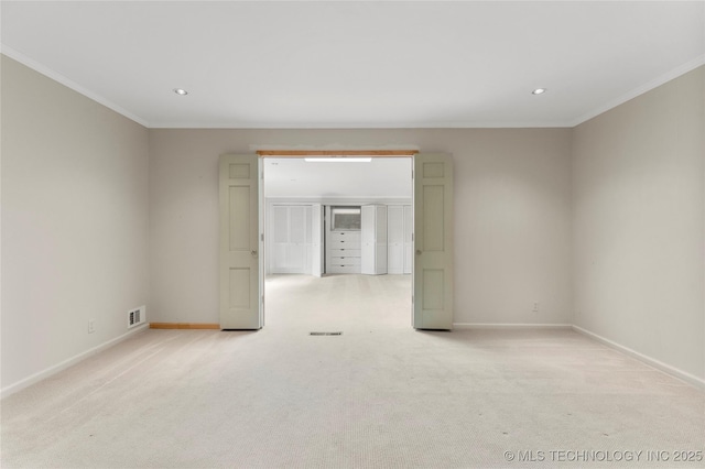empty room with ornamental molding, carpet flooring, and recessed lighting