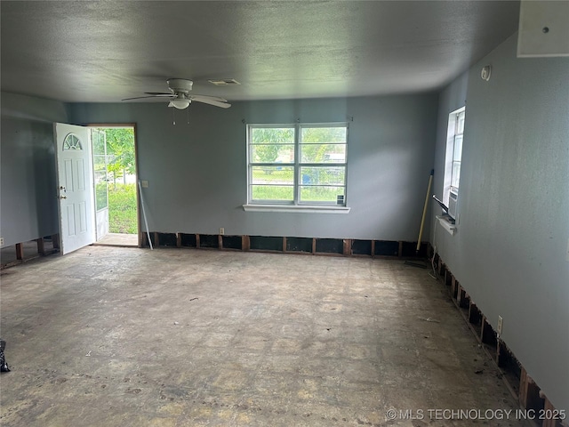 200 W Polk, Mcalester, OK 74501 - unfurnished room featuring healthy amount of natural light and ceiling fan