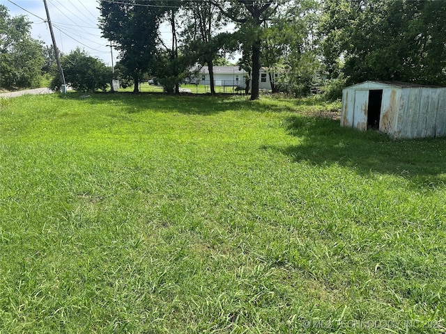 200 W Polk, Mcalester, OK 74501 - view of yard featuring a shed