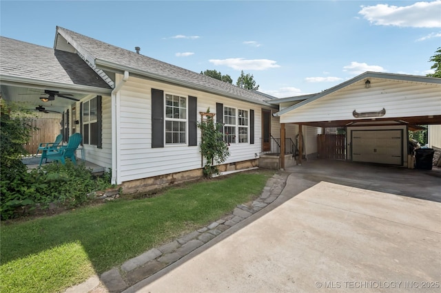 606 Goingsnake St, Tahlequah, OK 74464 - ranch-style house with a front lawn, concrete driveway, and roof with shingles