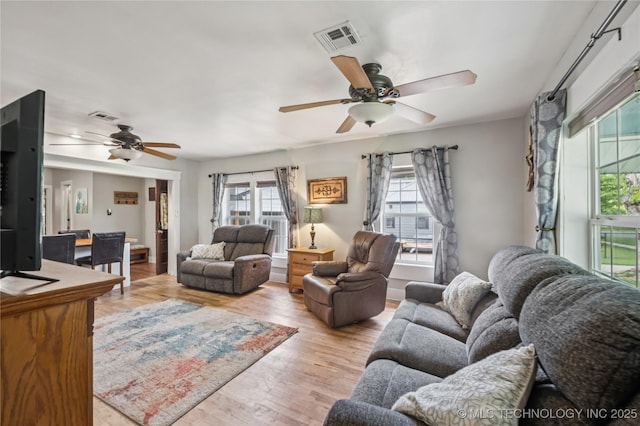 606 Goingsnake St, Tahlequah, OK 74464 - living area with a ceiling fan and wood finished floors