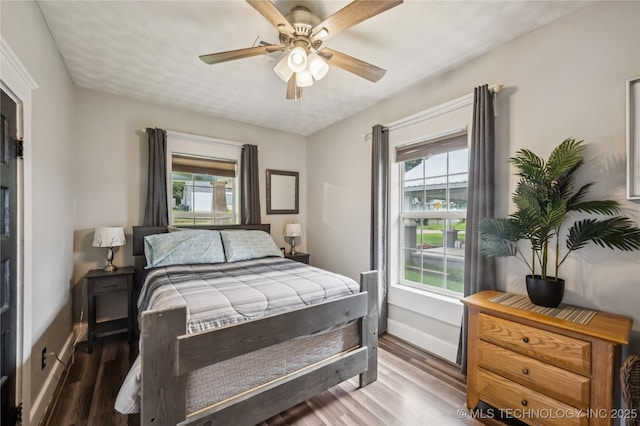 606 Goingsnake St, Tahlequah, OK 74464 - bedroom featuring wood finished floors and ceiling fan